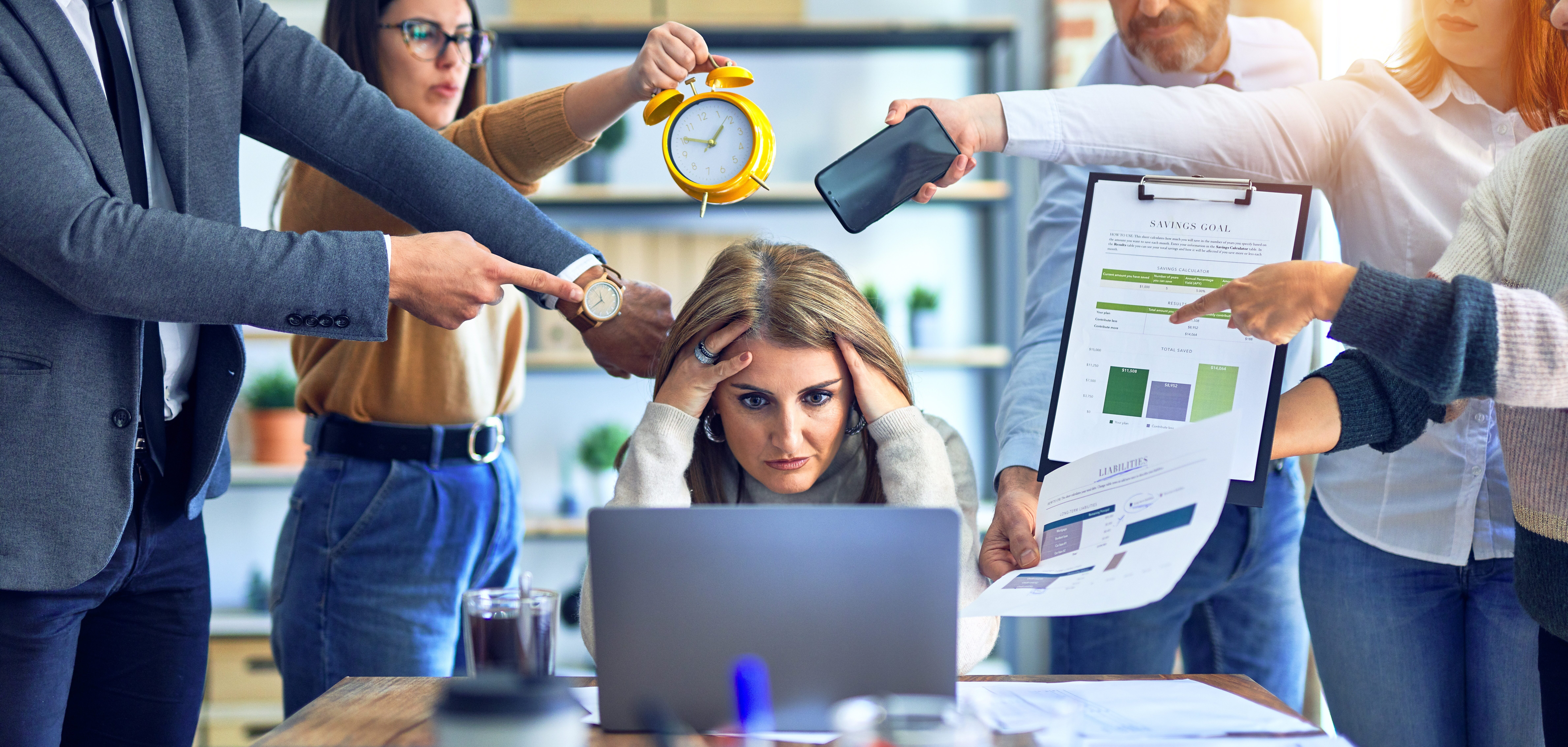 Group of business workers working together. Partners stressing one of them at the office